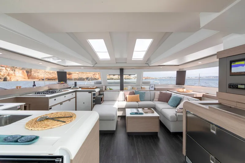 Slide: The Image of Modern interior of 2024 Fountaine Pajot Elba 45 catamaran with panoramic windows and luxurious seating. - 10