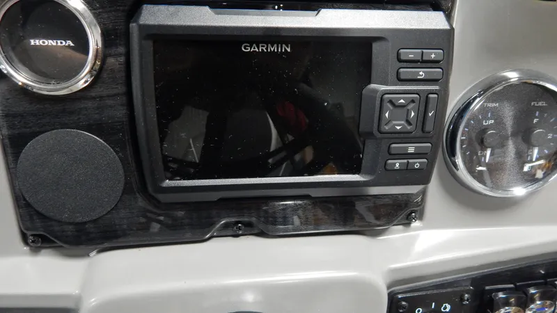 Slide: The Image of Garmin navigation system on 2024 Avalon Venture Cruise Rear Bench boat dashboard. - 7