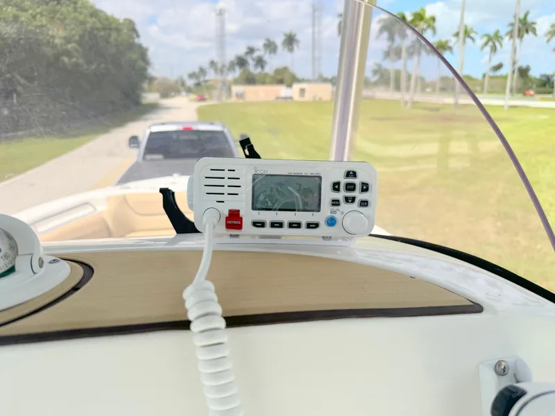Slide: The Image of VHF radio on the dashboard of a 2021 NauticStar 2302 Legacy boat. - 21