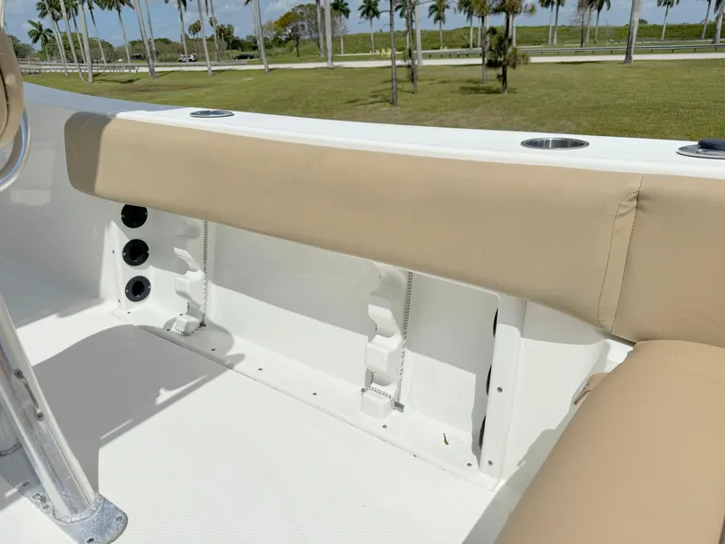 Slide: The Image of Interior seating of 2021 NauticStar 2302 Legacy boat with beige cushions. - 26
