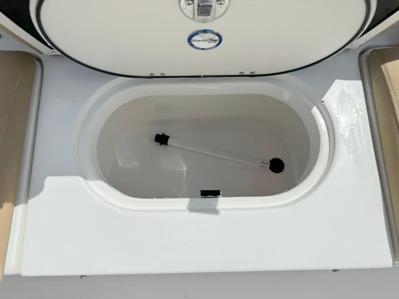 Slide: The Image of Open storage compartment on a 2021 NauticStar 2302 Legacy boat. - 29