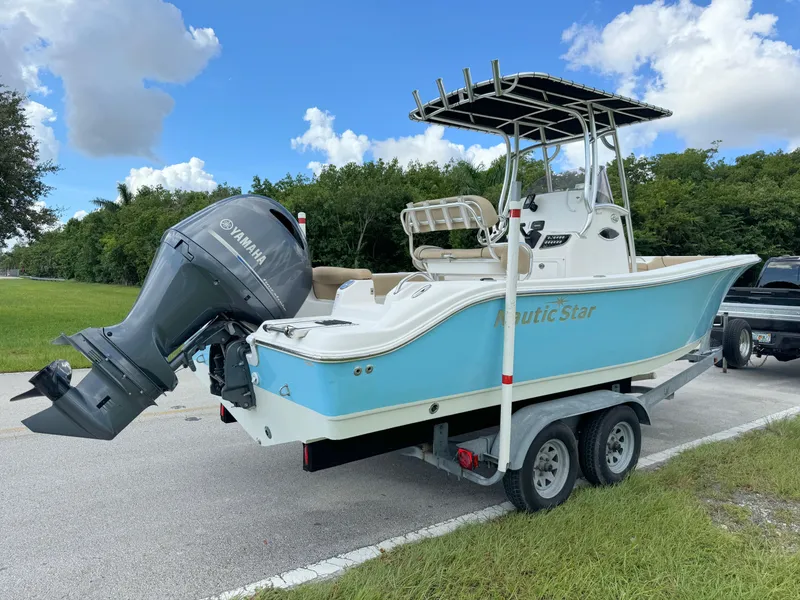 Slide: The Image of 2021 NauticStar 2302 Legacy boat on trailer with Yamaha outboard motor. - 4