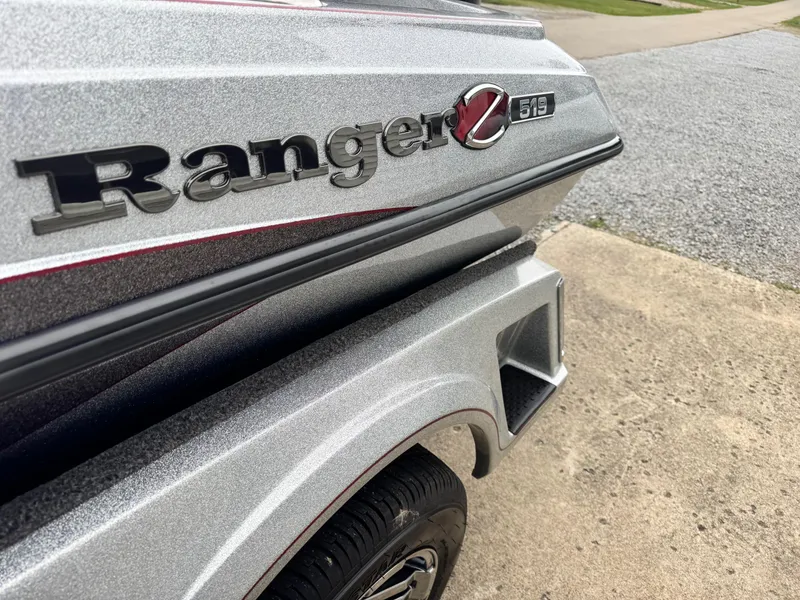 Slide: The Image of 2024 Ranger Z519C boat, close-up of logo and sleek design. - 10