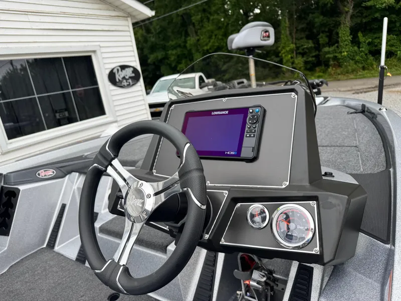 Slide: The Image of 2024 Ranger Z519C boat dashboard with steering wheel and navigation system. - 5
