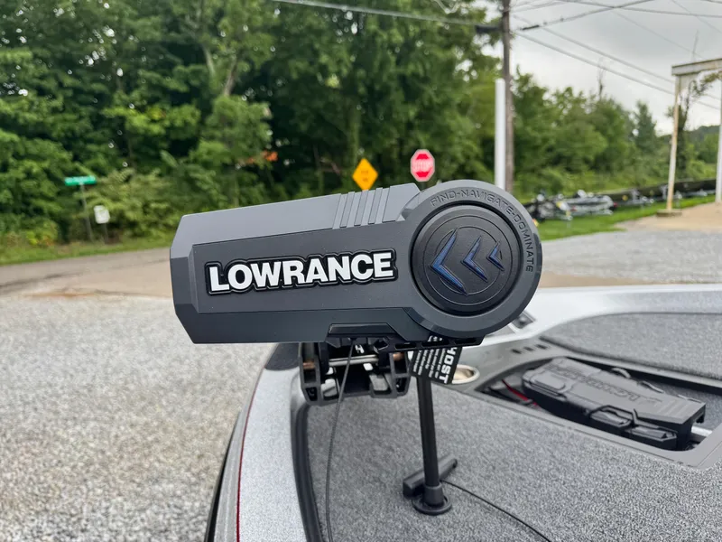 Slide: The Image of Lowrance device on 2024 Ranger Z519C boat, outdoor setting with trees and road signs. - 8