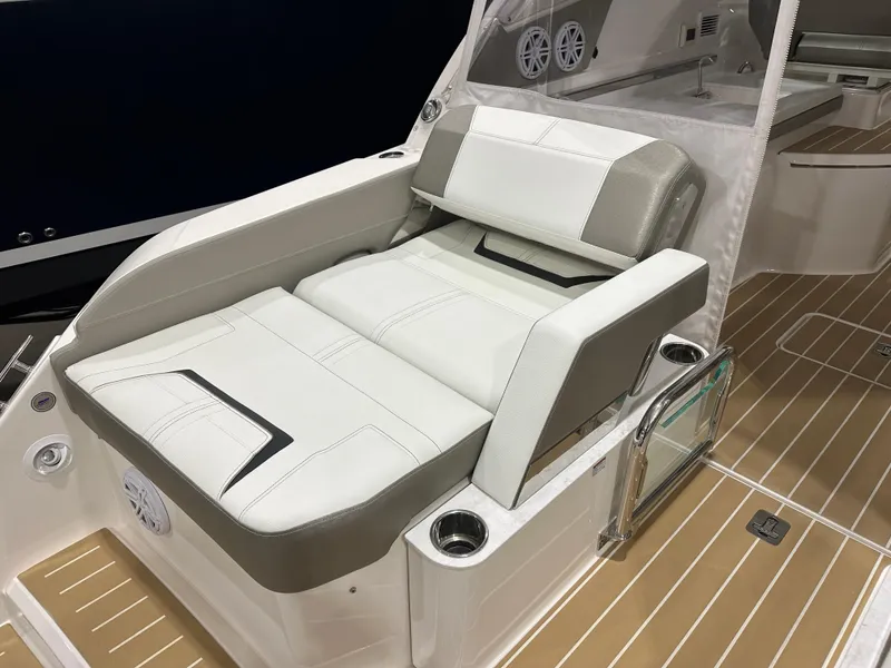 Slide: The Image of 2024 Tiara Yachts 34 LX luxury seating with beige and white upholstery on deck. - 10