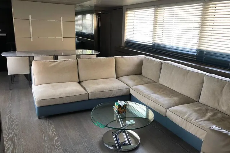 Slide: The Image of Modern interior of 2016 Sanlorenzo SL96 yacht with beige sectional sofa and glass coffee table. - 16
