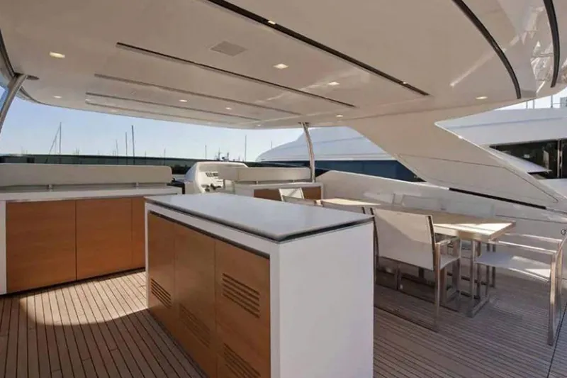 Slide: The Image of Sanlorenzo SL96 2016 yacht deck with modern outdoor kitchen and dining area. - 9