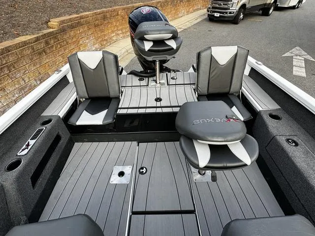 Slide: The Image of 2024 Vexus ADX180 boat interior with seating and motor. - 14