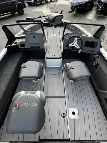 Slide: The Image of 2024 Vexus ADX180 boat interior with modern dashboard and seating. - 5