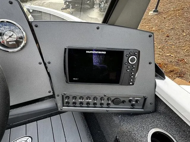 Slide: The Image of 2024 Vexus ADX180 boat dashboard with Humminbird fish finder and control panel. - 8