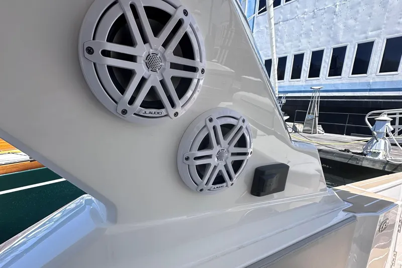 Slide: The Image of Close-up of 2024 Tiara Yachts 48 LS speakers and docked boat. - 15