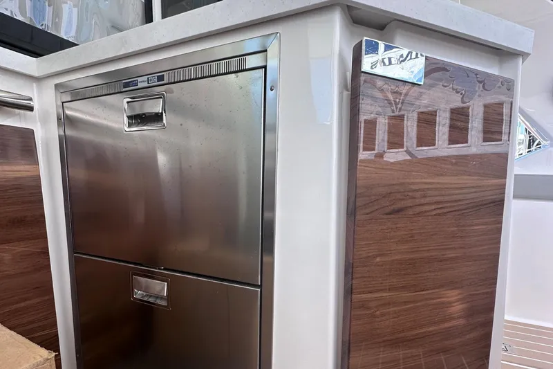 Slide: The Image of Stainless steel and wood cabinetry on 2024 Tiara Yachts 48 LS. - 17