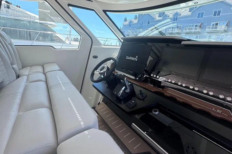 Slide: The Image of 2024 Tiara Yachts 48 LS helm station with Garmin navigation system. - 19
