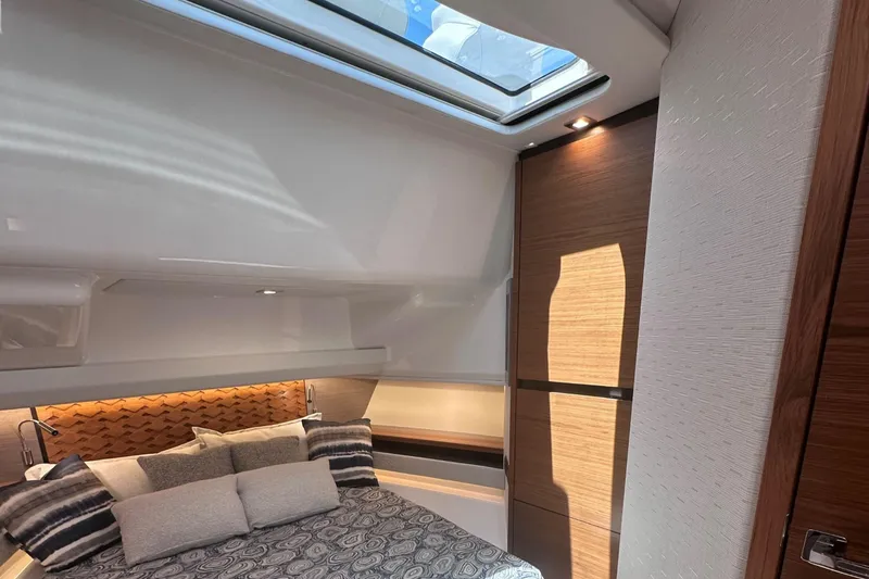 Slide: The Image of Luxurious bedroom interior of 2024 Tiara Yachts 48 LS with skylight and modern design. - 21