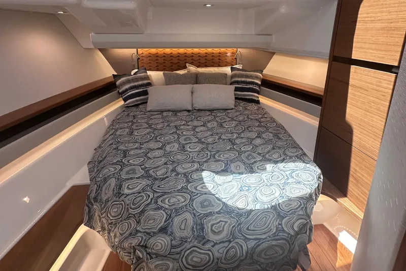 Slide: The Image of Luxurious bedroom interior of 2024 Tiara Yachts 48 LS with modern bedding. - 22