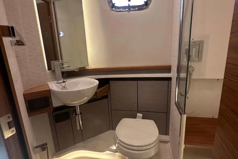 Slide: The Image of Modern bathroom in 2024 Tiara Yachts 48 LS, featuring sleek fixtures and ample storage. - 24