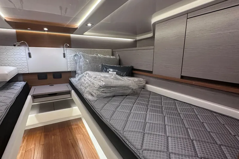 Slide: The Image of 2024 Tiara Yachts 48 LS cabin interior with modern design and comfortable bedding. - 29