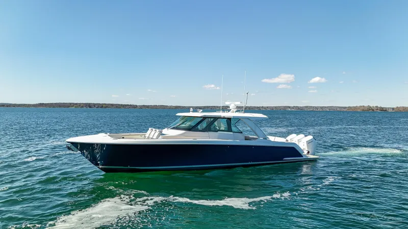 Slide: The Image of 2024 Tiara Yachts 48 LS cruising on open water. - 3