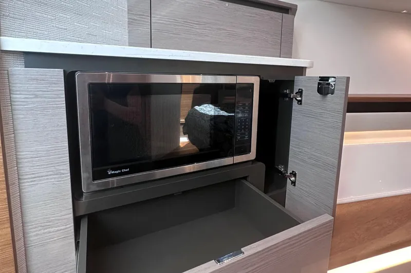 Slide: The Image of Built-in microwave in the 2024 Tiara Yachts 48 LS kitchen. - 34