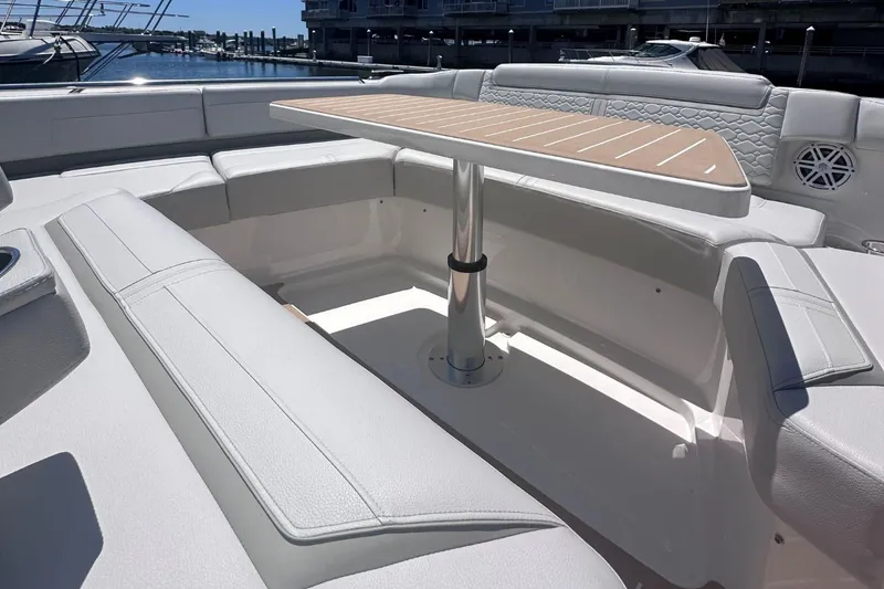 Slide: The Image of 2024 Tiara Yachts 48 LS luxury boat seating area with table. - 41