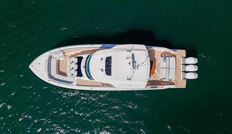 Slide: The Image of Aerial view of 2024 Tiara Yachts 48 LS luxury boat on water. - 5