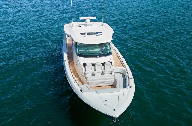 Slide: The Image of 2024 Tiara Yachts 48 LS luxury boat on open water. - 7