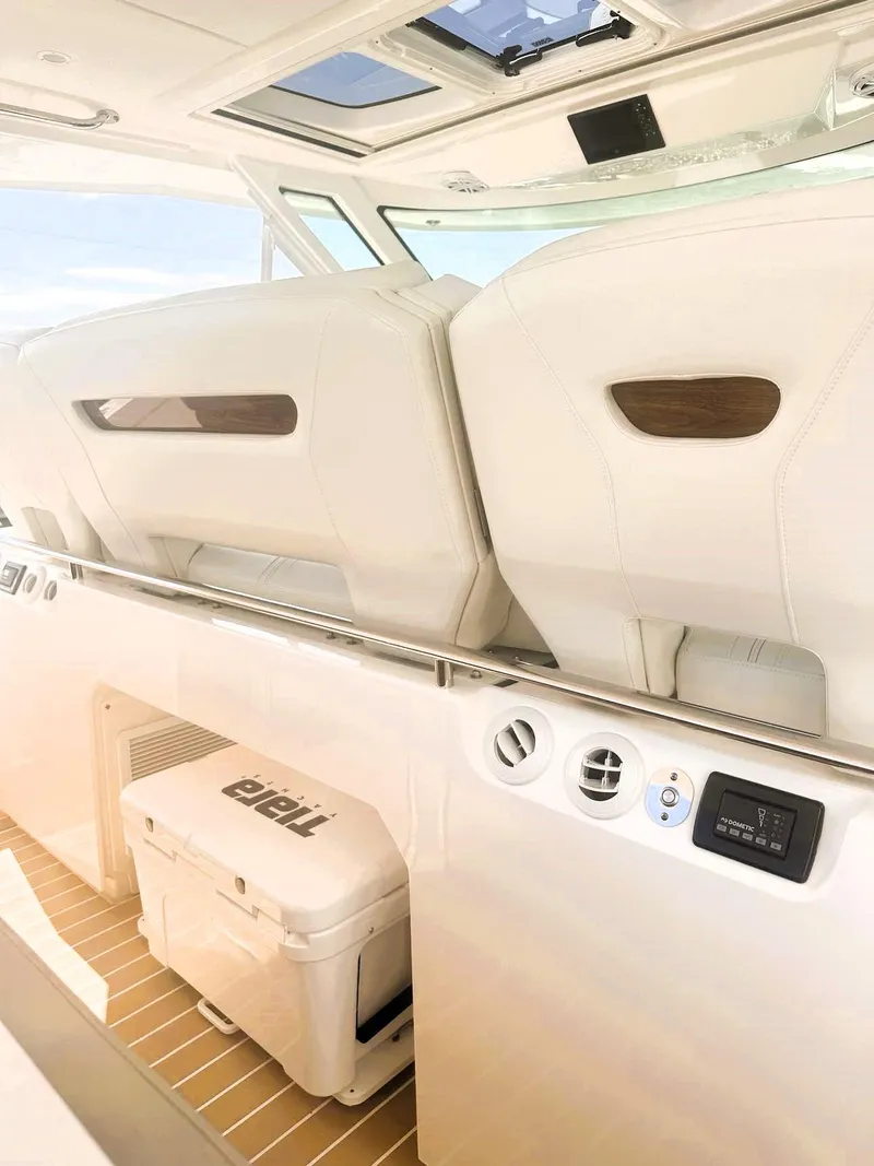 Slide: The Image of 2024 Tiara Yachts 43 LS interior with white seating and modern amenities. - 28