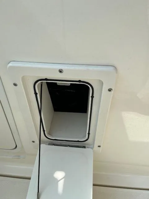 Slide: The Image of 2018 Boston Whaler 270 Vantage storage compartment. - 14