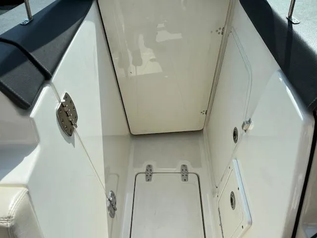 Slide: The Image of 2018 Boston Whaler 270 Vantage boat interior with storage compartments. - 20