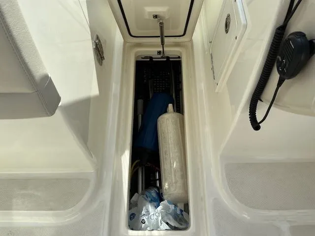 Slide: The Image of Storage compartment of a 2018 Boston Whaler 270 Vantage boat with various equipment. - 21