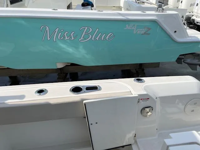 Slide: The Image of 2018 Boston Whaler 270 Vantage Miss Blue boat docked, showing side and deck. - 30
