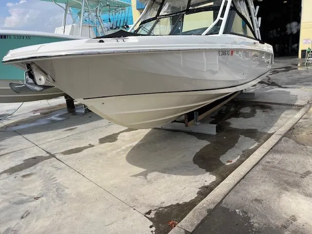 Slide: The Image of 2018 Boston Whaler 270 Vantage boat on a concrete dock, side view. - 4