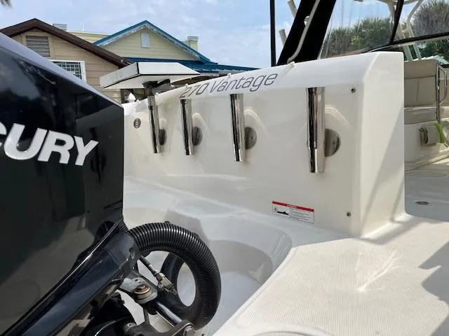 Slide: The Image of 2018 Boston Whaler 270 Vantage boat with Mercury engine, docked near houses. - 42