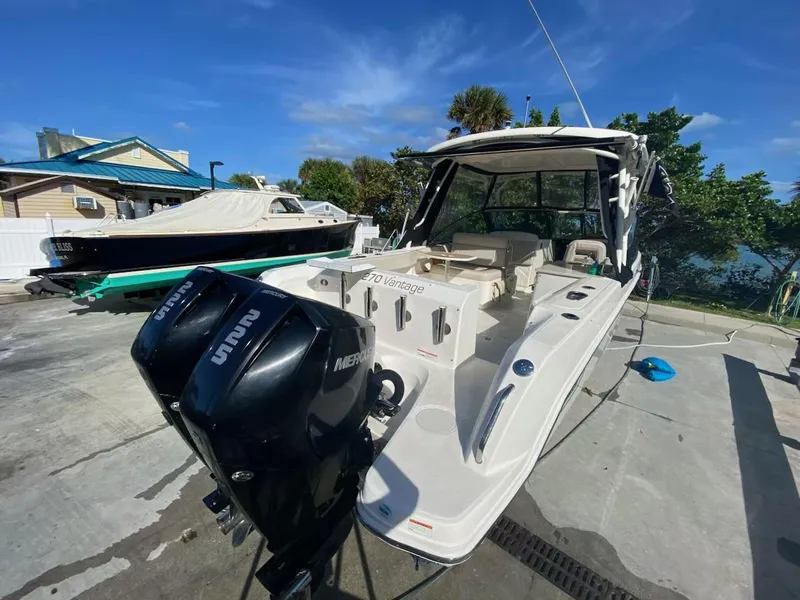 Slide: The Image of 2018 Boston Whaler 270 Vantage boat with dual Mercury outboard engines. - 7