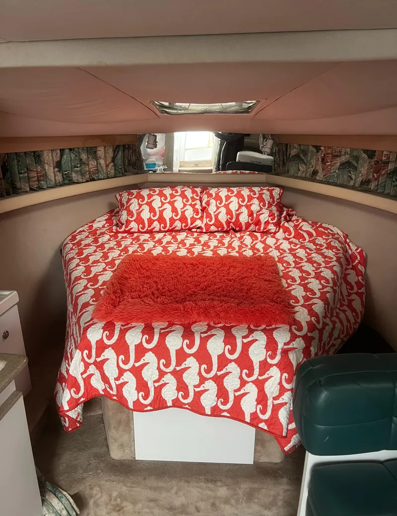 Slide: The Image of 1997 Formula 34 PC cabin with seahorse-patterned bedding and cozy interior. - 13
