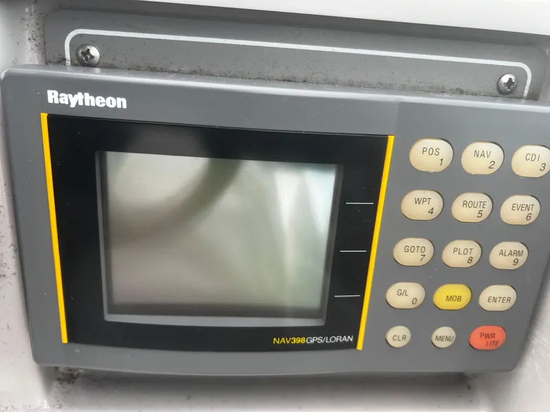 Slide: The Image of Raytheon NAV398 GPS/LORAN device on a 1997 Formula 34 PC boat. - 16