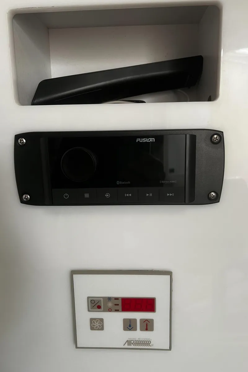 Slide: The Image of Engine compartment of a 1997 Formula 34 PC boat, featuring wiring and components. - 17