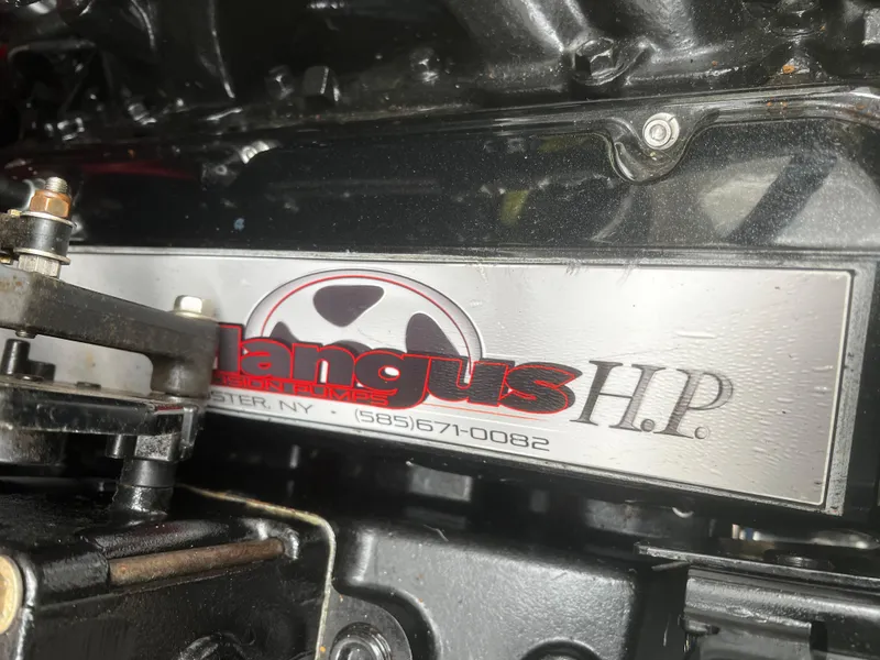 Slide: The Image of Engine detail of a 1997 Formula 34 PC with Angus H.P. branding. - 27