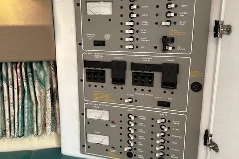 Slide: The Image of Control panel of a 1997 Formula 34 PC boat with switches and meters. - 31