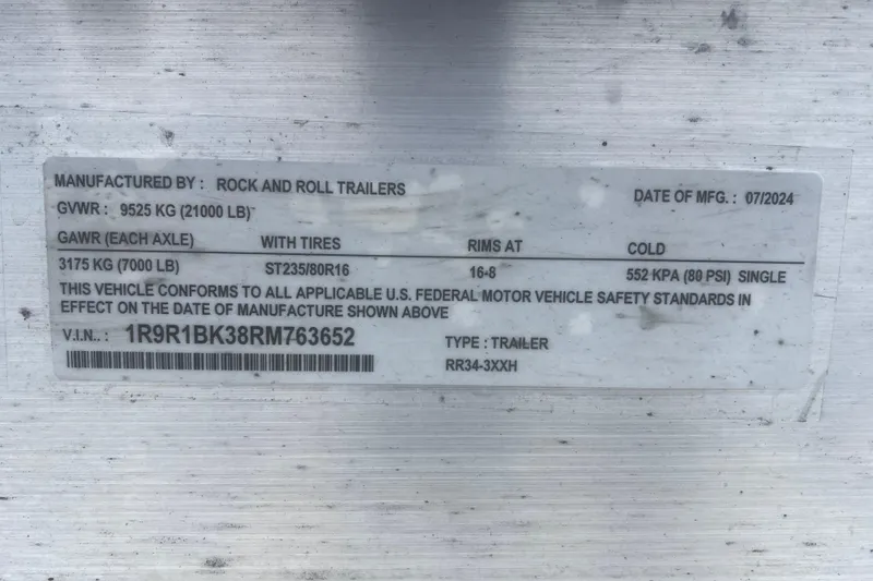Slide: The Image of Label on a trailer showing specifications and compliance details, manufactured by Rock and Roll Trailers. - 33