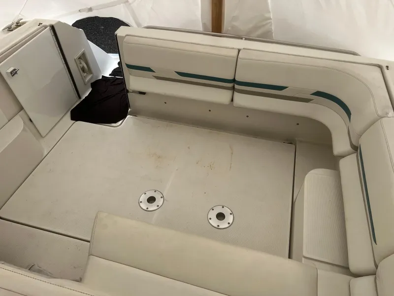 Slide: The Image of 1997 Formula 34 PC boat docked, featuring white exterior and teal accents. - 5