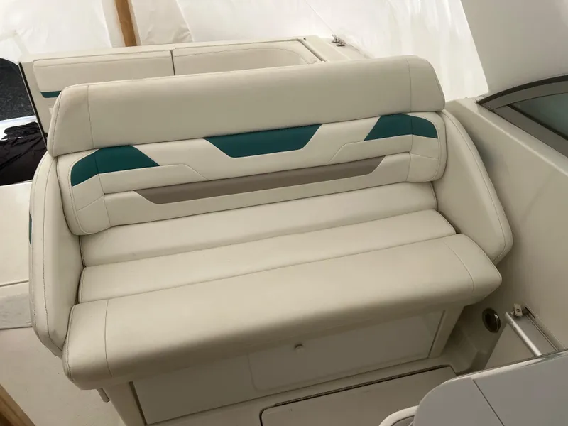 Slide: The Image of 1997 Formula 34 PC boat interior with white seating and table. - 6
