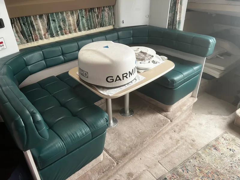 Slide: The Image of 1997 Formula 34 PC yacht kitchen with sink, stove, microwave, and compact fridge. - 9