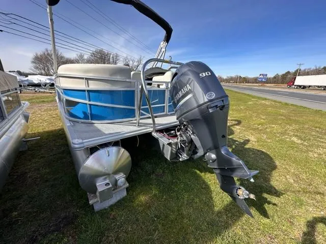 Slide: The Image of 2024 Starcraft LX 20 R pontoon boat with Yamaha 90 outboard motor. - 6