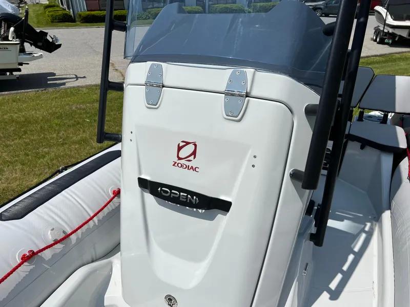 Slide: The Image of 2023 Zodiac Open 5.5 boat console with logo and controls. - 10