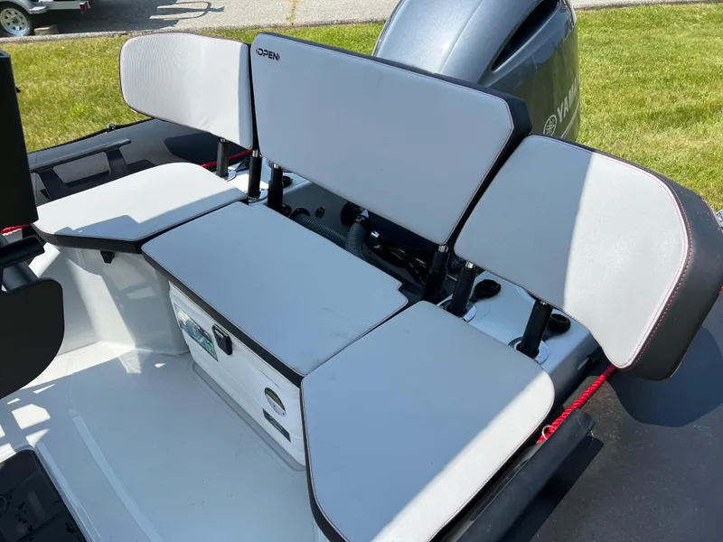 Slide: The Image of 2023 Zodiac Open 5.5 boat seating area with Yamaha outboard motor. - 6