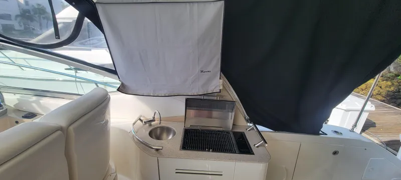 Slide: The Image of 2008 Sea Ray 350 Sundancer boat interior with kitchenette and sink. - 10