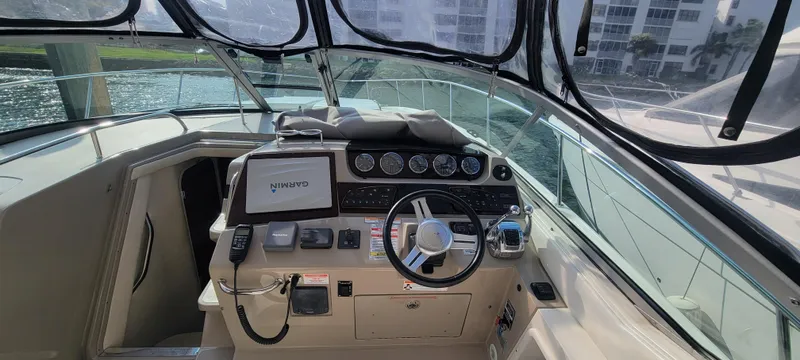 Slide: The Image of 2008 Sea Ray 350 Sundancer boat helm with navigation system and controls. - 14