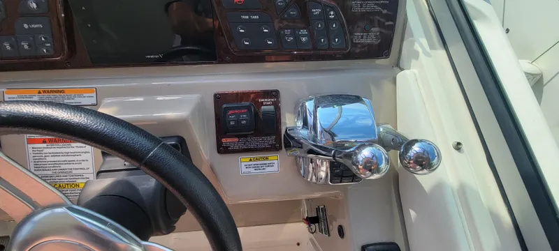 Slide: The Image of Control panel of a 2008 Sea Ray 350 Sundancer boat with steering wheel and throttle. - 18